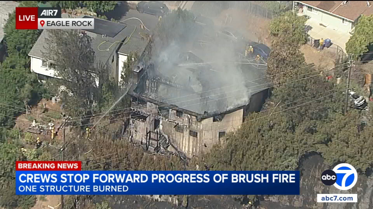 Brush fire in Eagle Rock tears through home, injures LA firefighter