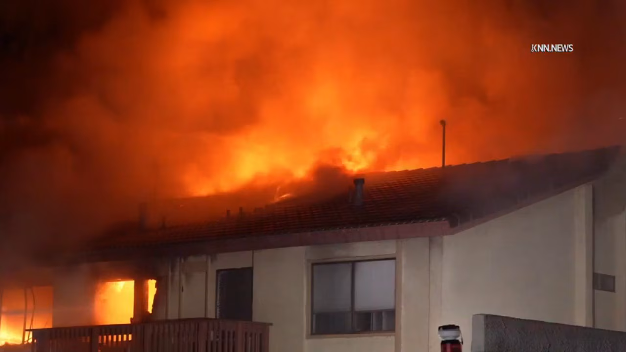 Townhouse catches fire during standoff in Woodland Hills